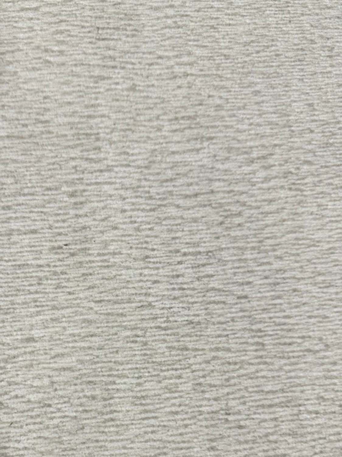 Four tiles in color Etheria Grey with a chiseled textured finish.