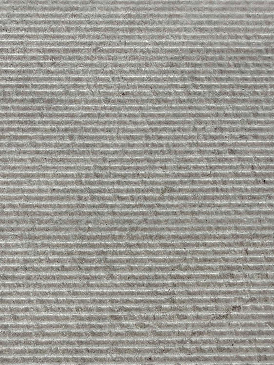 Four tiles in color Etheria Grey with a fine-grooved textured finish.