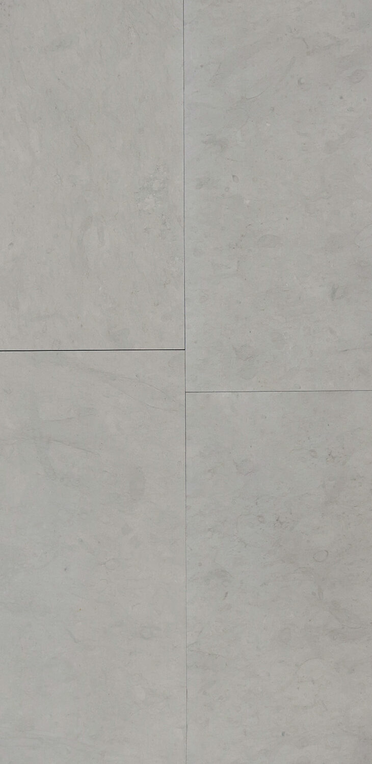 Four tiles in color Etheria Grey with a honed finish.