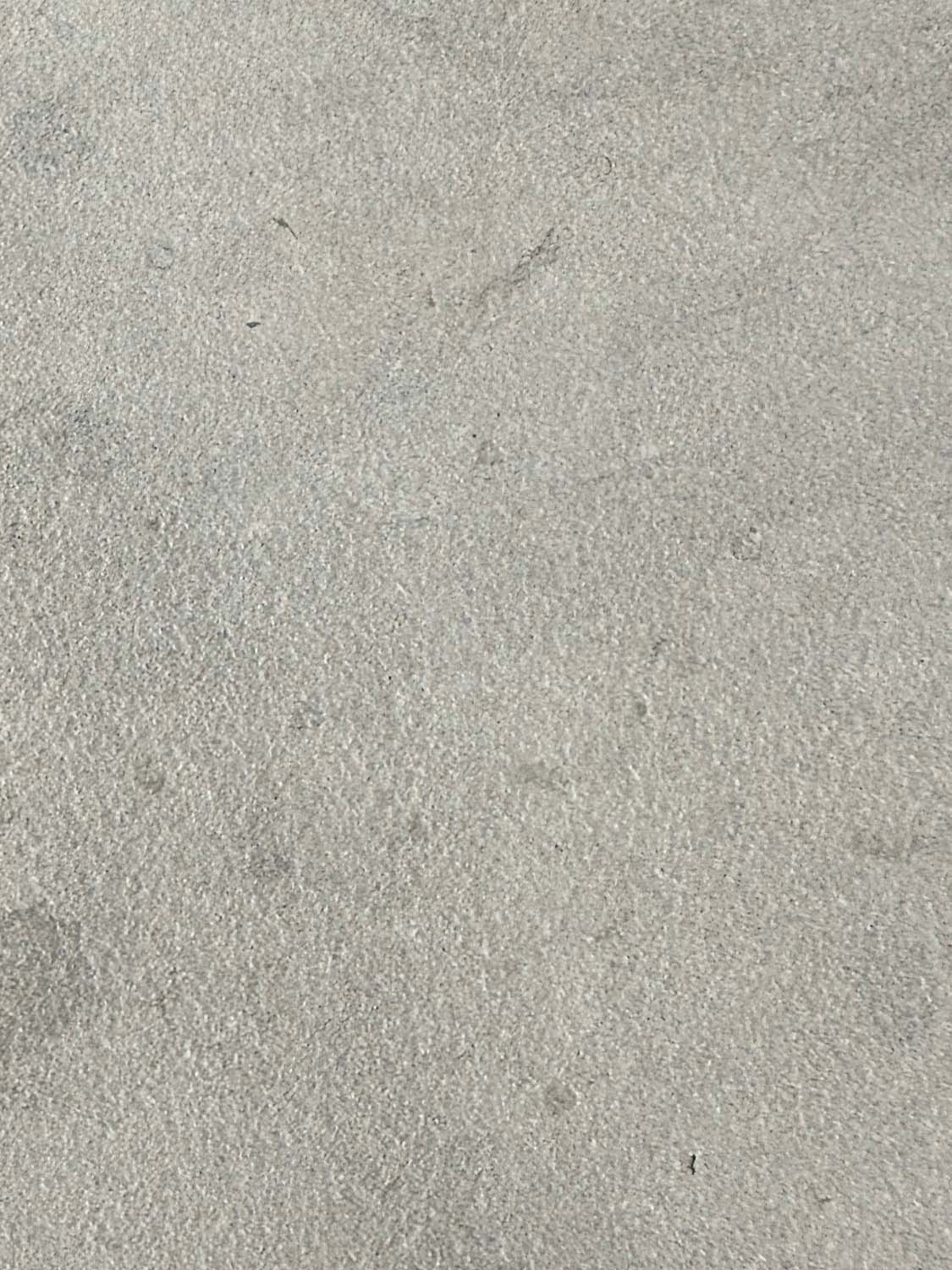 Four tiles in color Etheria Grey with a sandblasted finish.